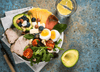 Healthy meats, vegetables, and cheeses on a plate consistent with the Alzheimer's prevention diet
