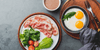 Bacon, eggs and vegetables on a plate which are part of a bulletproof diet