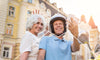 Older man and woman sitting on a bike and showing signs of aging well