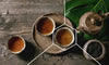 Cups of black tea on a tray