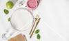 An empty plate and a clock