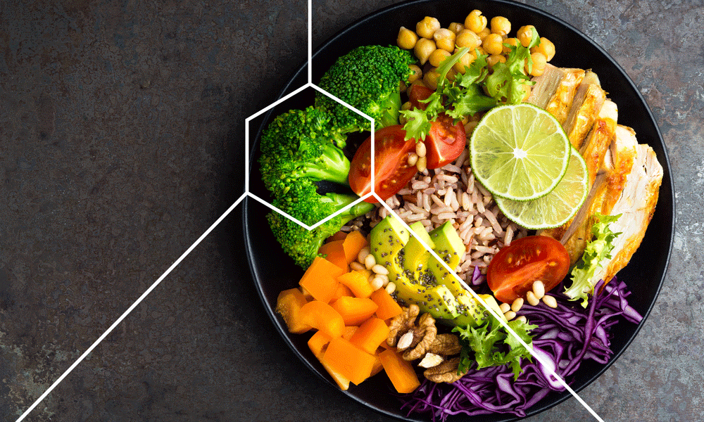 Bowl of broccoli, carrots, chickpeas, salmon, cabbage and other healthy foods for weight loss