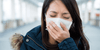 Woman wearing a face mask wondering how the immune system works