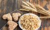 Wheat germ in a bowl with heart shaped wheat patties representing whether or not wheat germ is bad for you