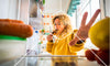 Woman reaching for healthy foods to help her slow metabolism
