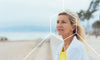 Woman with healthy hair on the beach from taking spermidine supplements