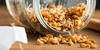 Jar of wheat germ spilling on the table