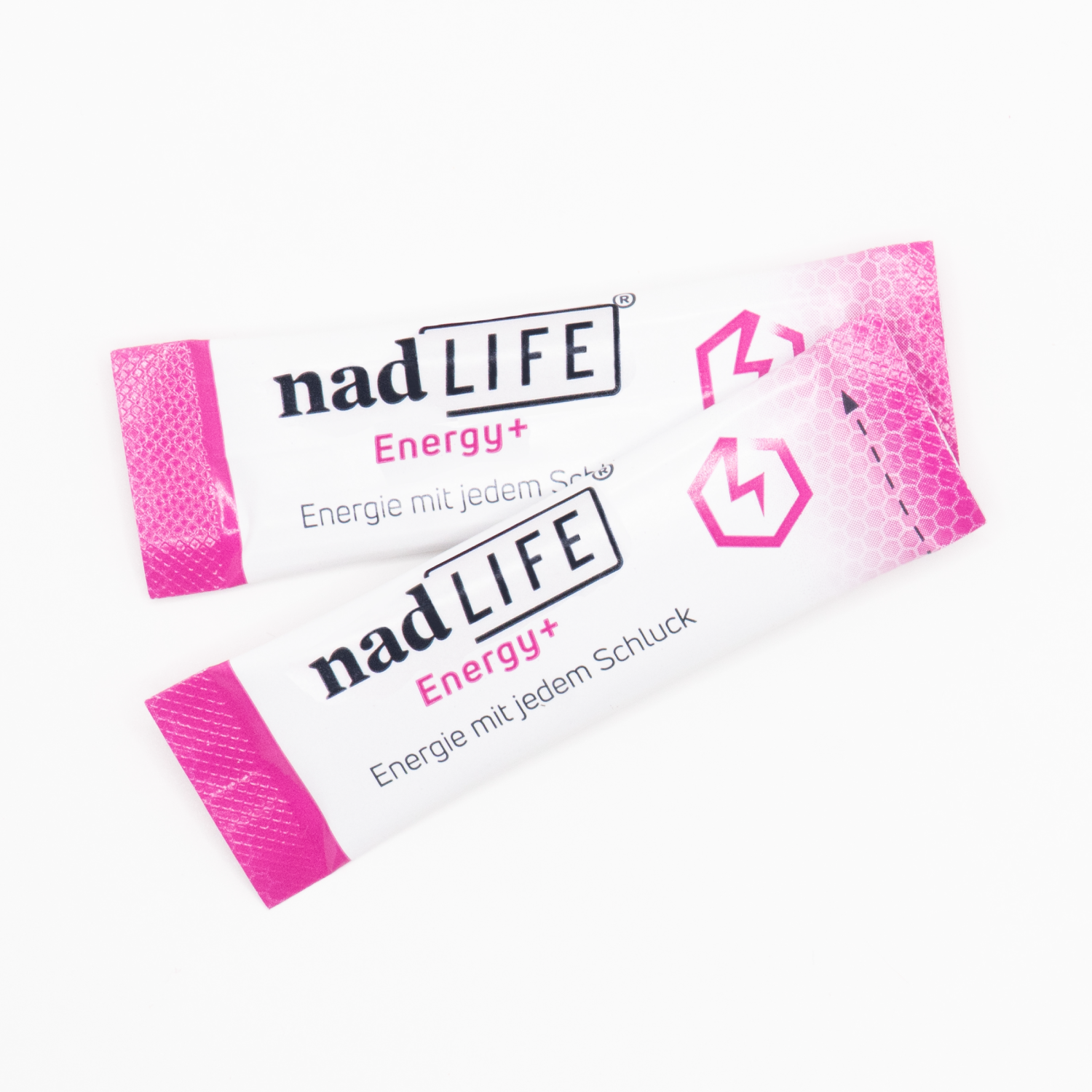 Two packets of nadLIFE® Energy+ Dietary Supplement by spermidineLIFE® from Longevity Labs, Inc., with pink and white packaging that features a logo and the text "Energie mit jedem Schluck." This energy booster supports cell regeneration for a healthier you.