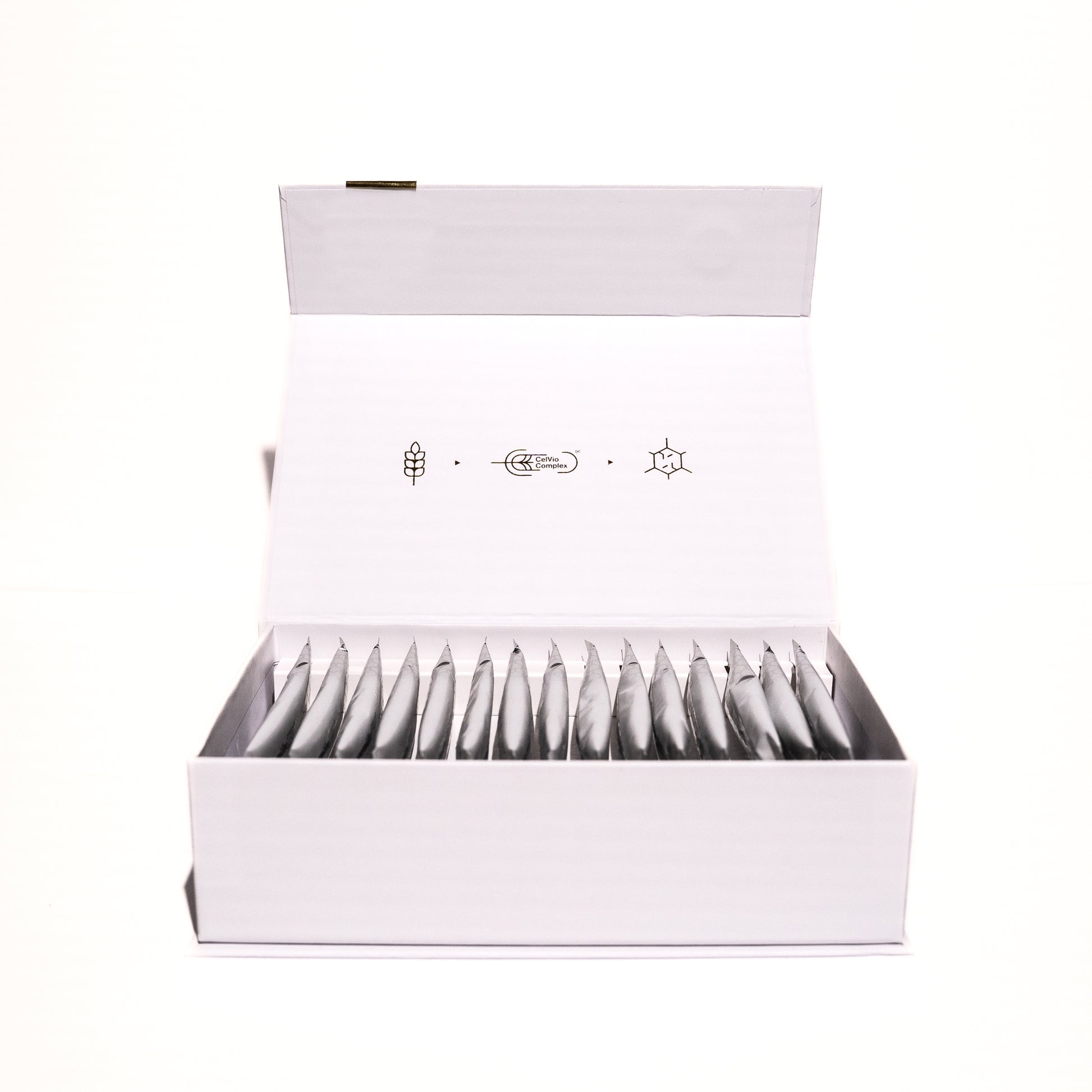 A white box with its lid open reveals multiple packets arranged inside. Simple black line icons on the lid indicate this is spermidineLIFE® Pro+ 4300mg 30-Pack, a dietary supplement by Longevity Labs, Inc featuring Celvio® Complex.