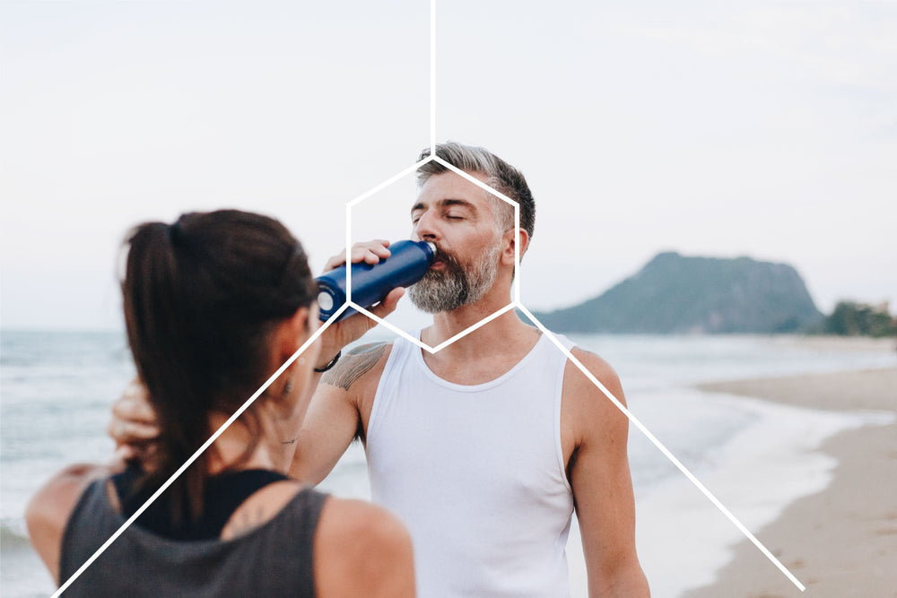 couple on a beach working out