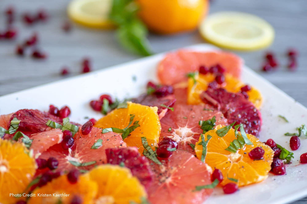citrus fruits on a plate that are high in polyamines