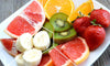 Plate of fruit that are good for the brain - strawberries, citrus, kiwi, and bananas