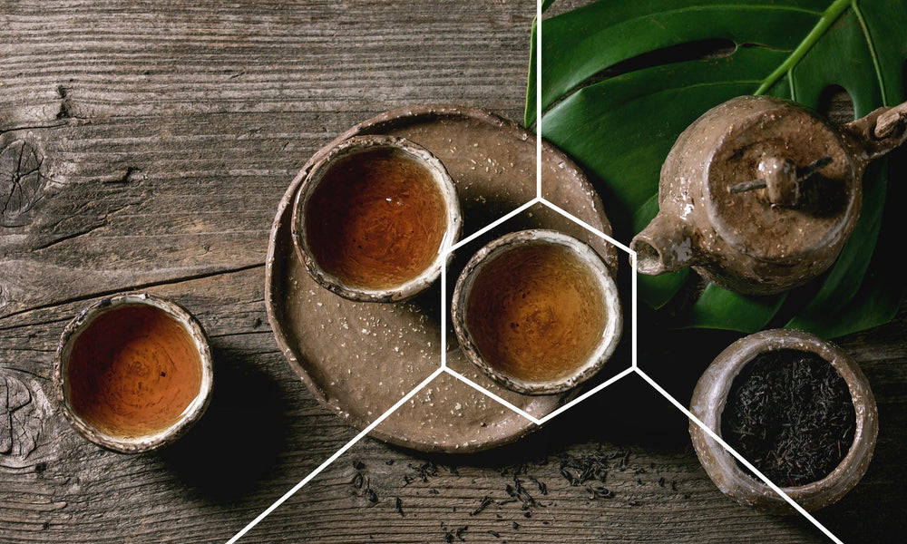 Cups of black tea on a tray