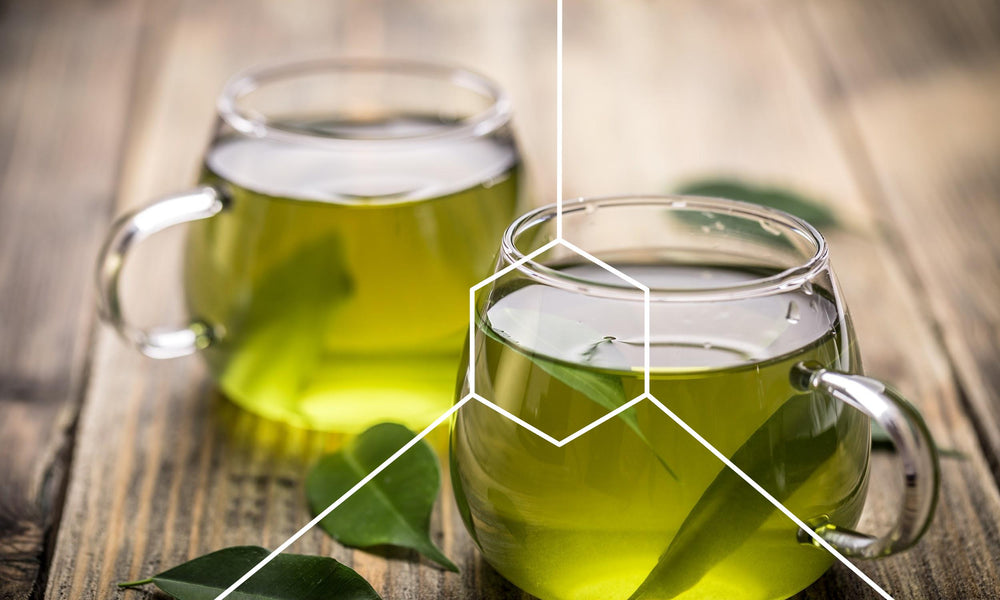Healthy green tea in cups on a table