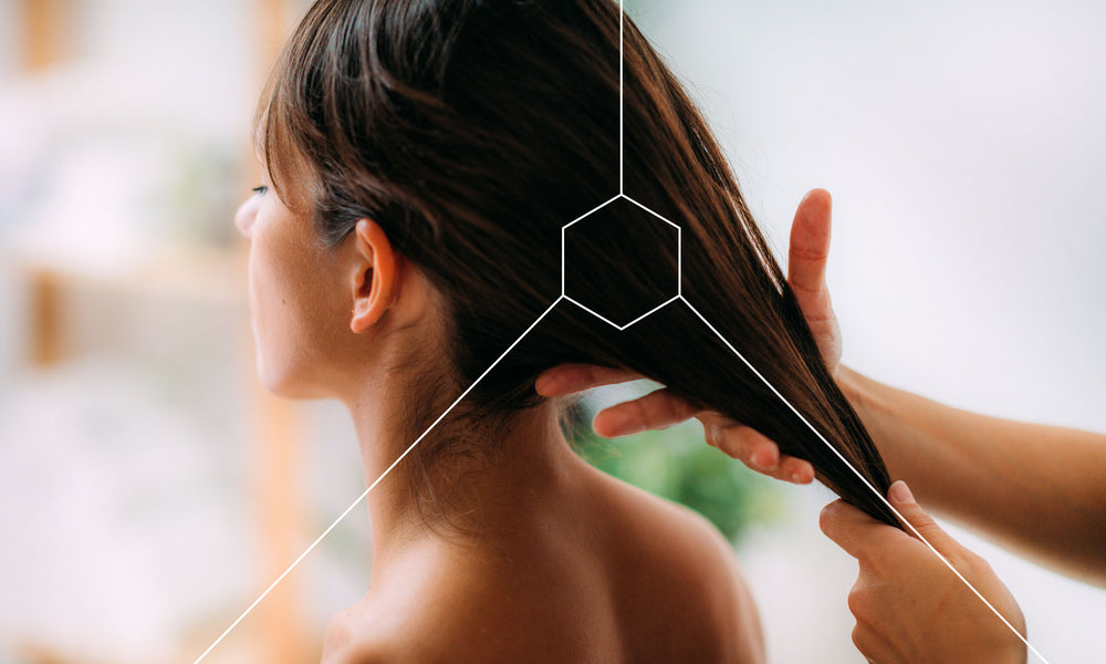 Woman working with a stylist that is telling her how to grow thicker hair