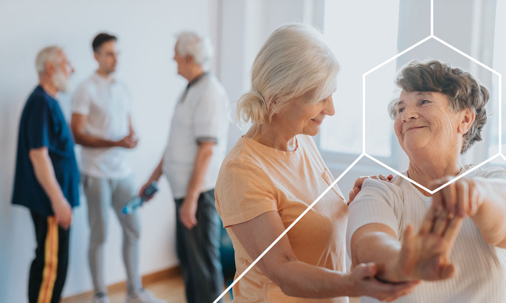 Elderly woman working with a physical therapist to avoid negative affects on the muscular system