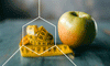 Apple sitting next to a measuring tape representing weight loss tips