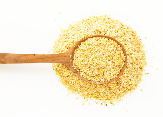 A spoonful of quinoa, promoting longevity and fasting, on a white background.
